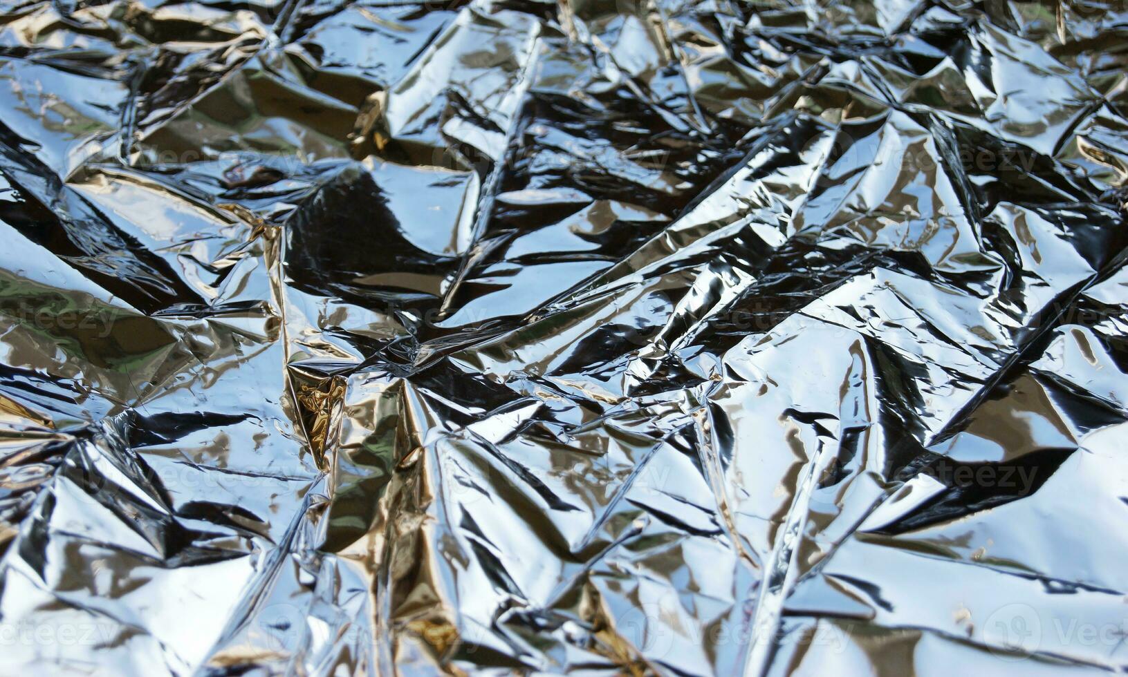 Silver Leaf Foil Background with Shiny Crumpled Uneven Surface for