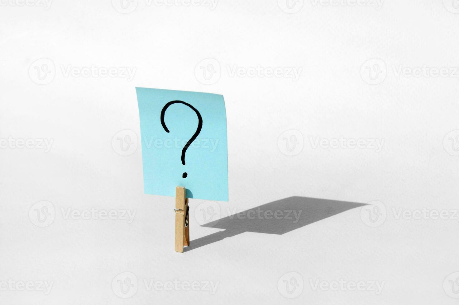 One clothespin with a question mark on the sticker. The concept of business, management, markets, creativity. photo