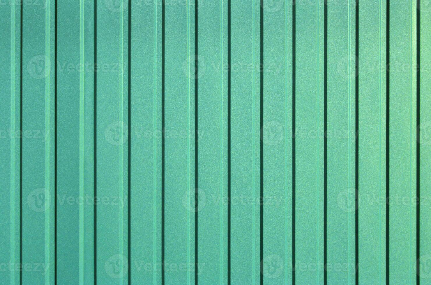 Turquoise background of metal wall siding, cladding. photo