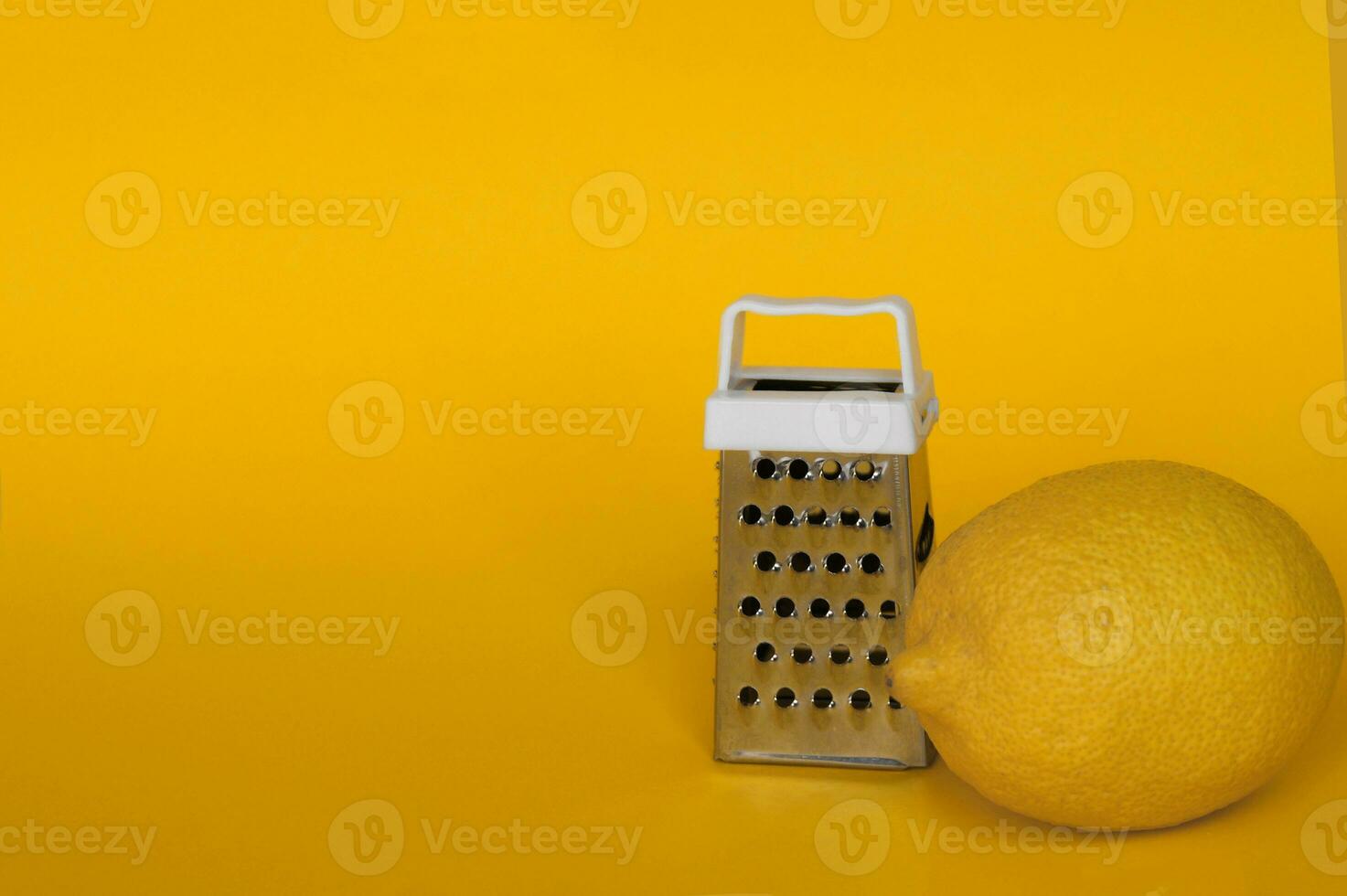 Fresh lemon and grater stainless. photo