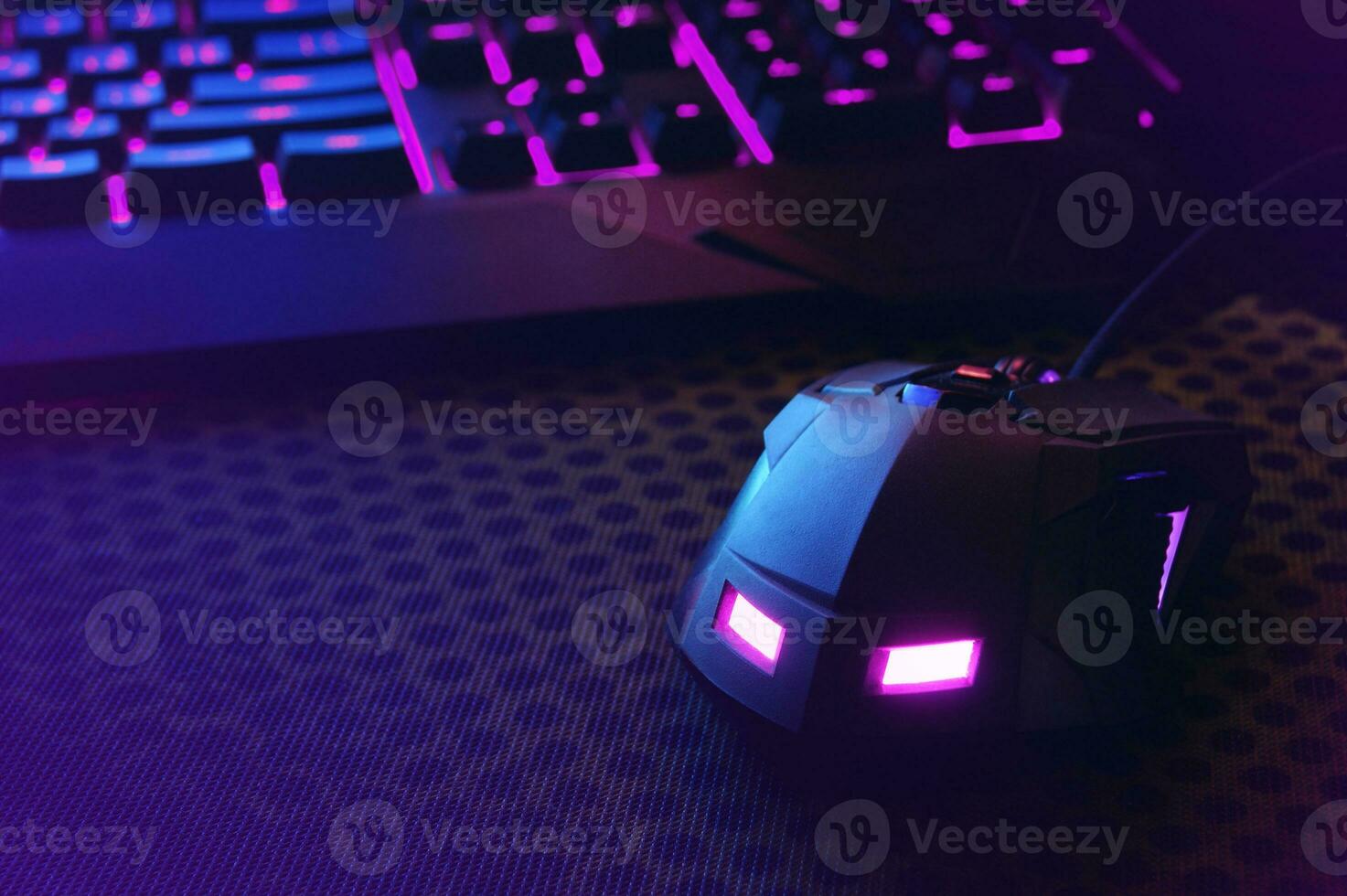 Workspace with a keyboard and mouse on dark background. photo