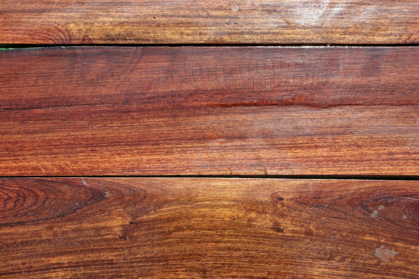 Top view of a varnished plank floor and seeing the connections of the boards. photo