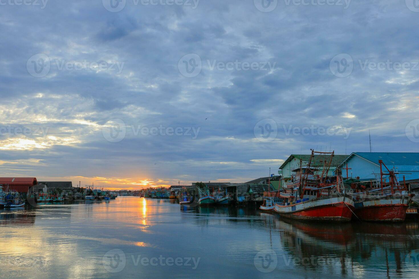 Many fishing boats are moored at the pier. photo