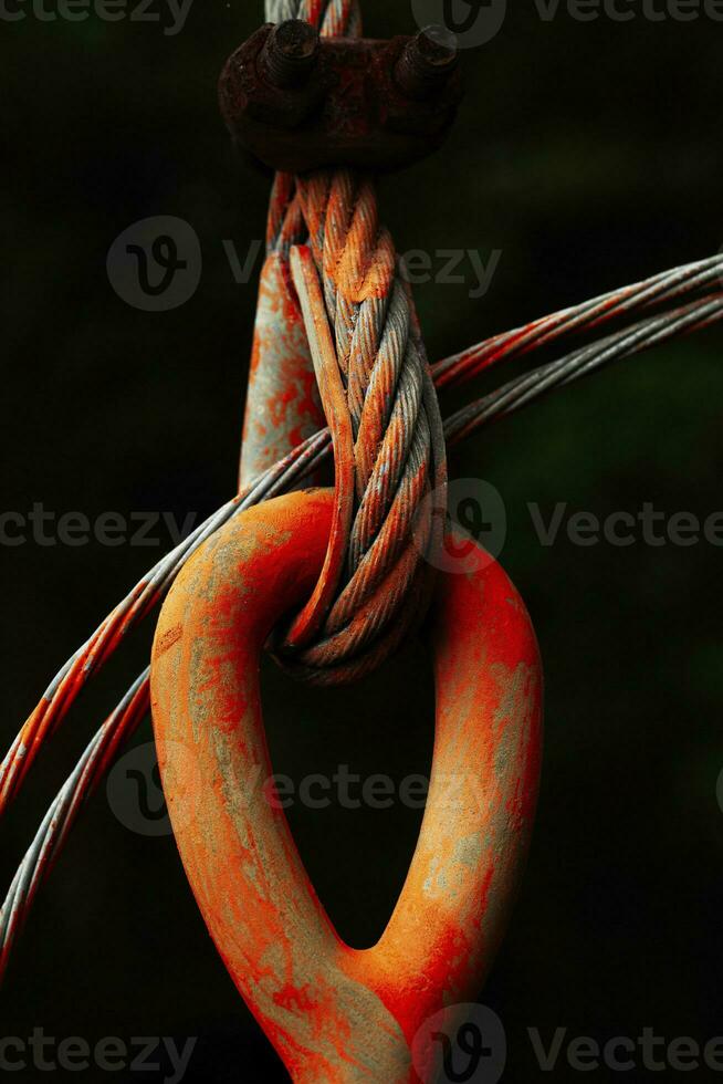 Large orange wires strung together. photo