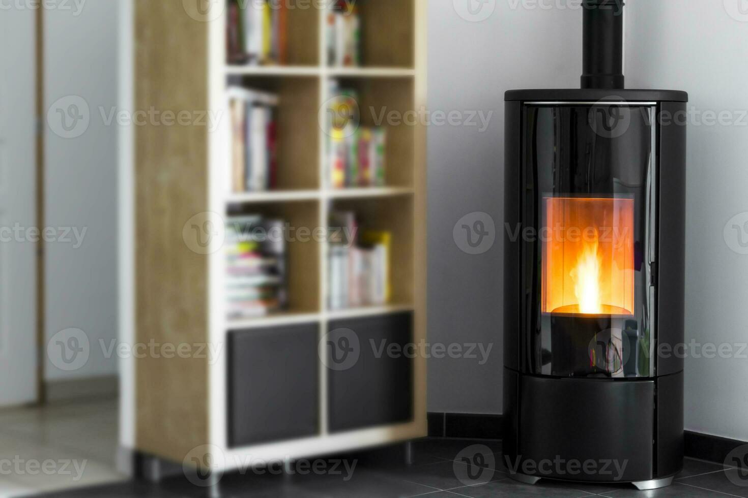 Modern domestic pellet stove, granules stove with flames and library photo