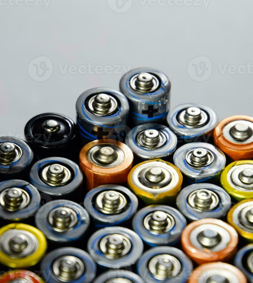 Salt and alkaline batteries, source of energy for portable technology. AAA and AA batteries photo