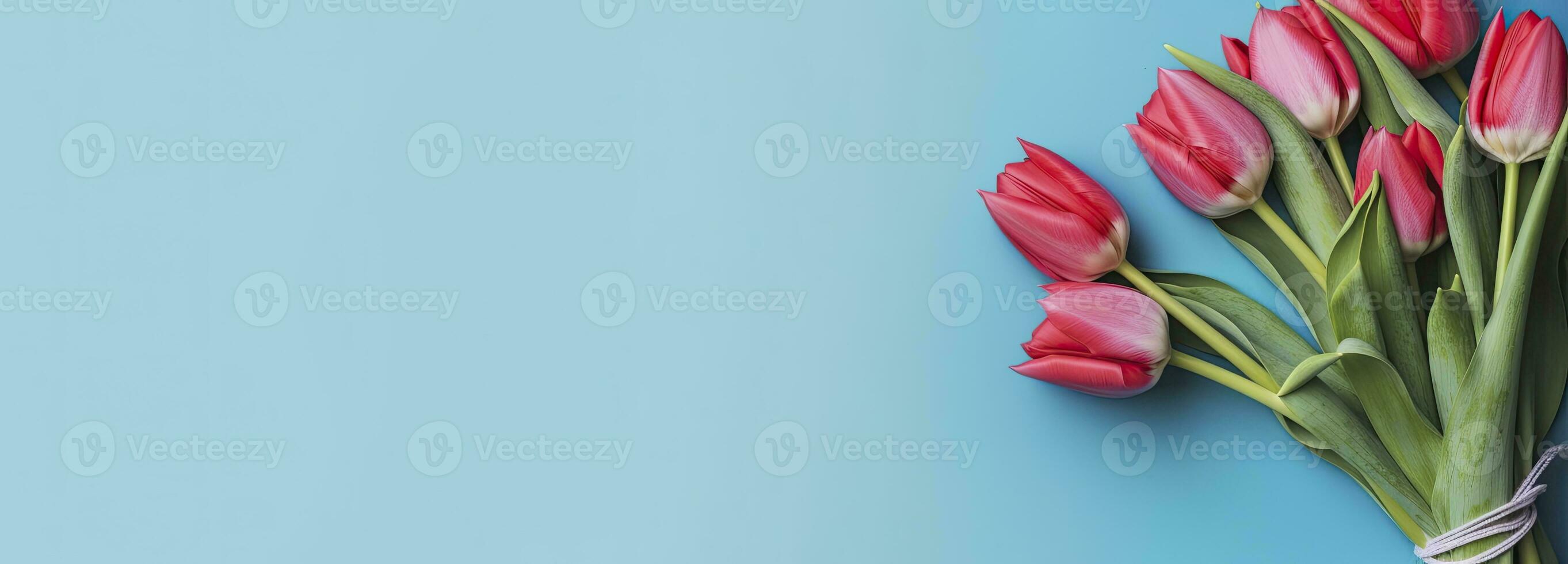 AI generated Bouquet of red tulip on blue Background. Top view with copy space.  AI Generated photo