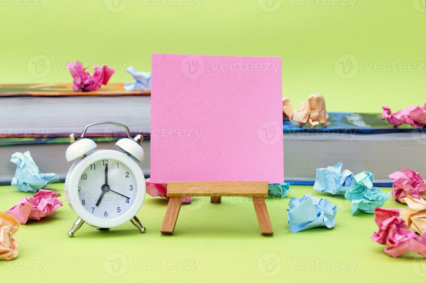 A small easel with a blank sticker on the background of the educational installation. photo