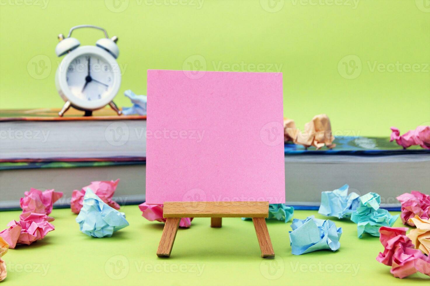 A small easel with a blank sticker on the background of the educational installation. photo