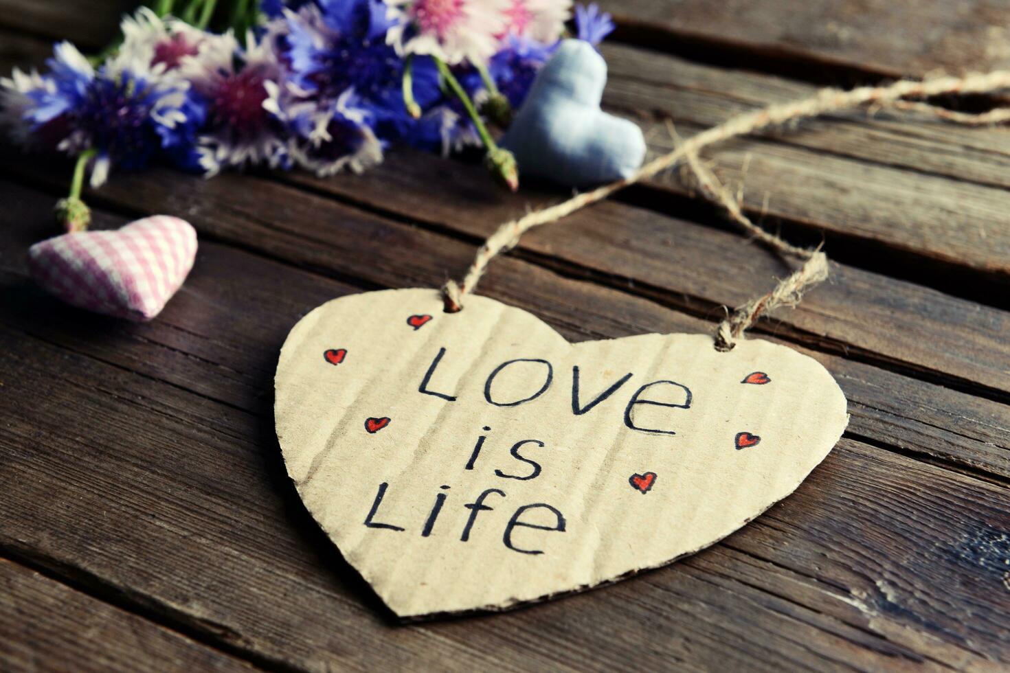 Written Message with Dry Flowers on Table photo