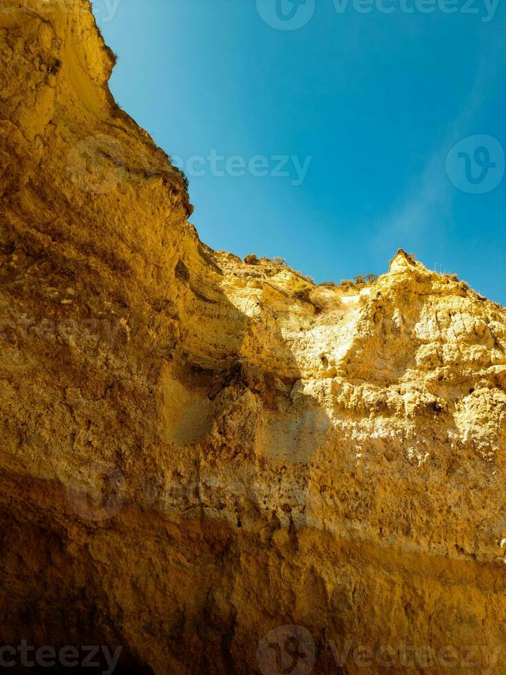 Rugged canyon walls under a clear blue sky. photo