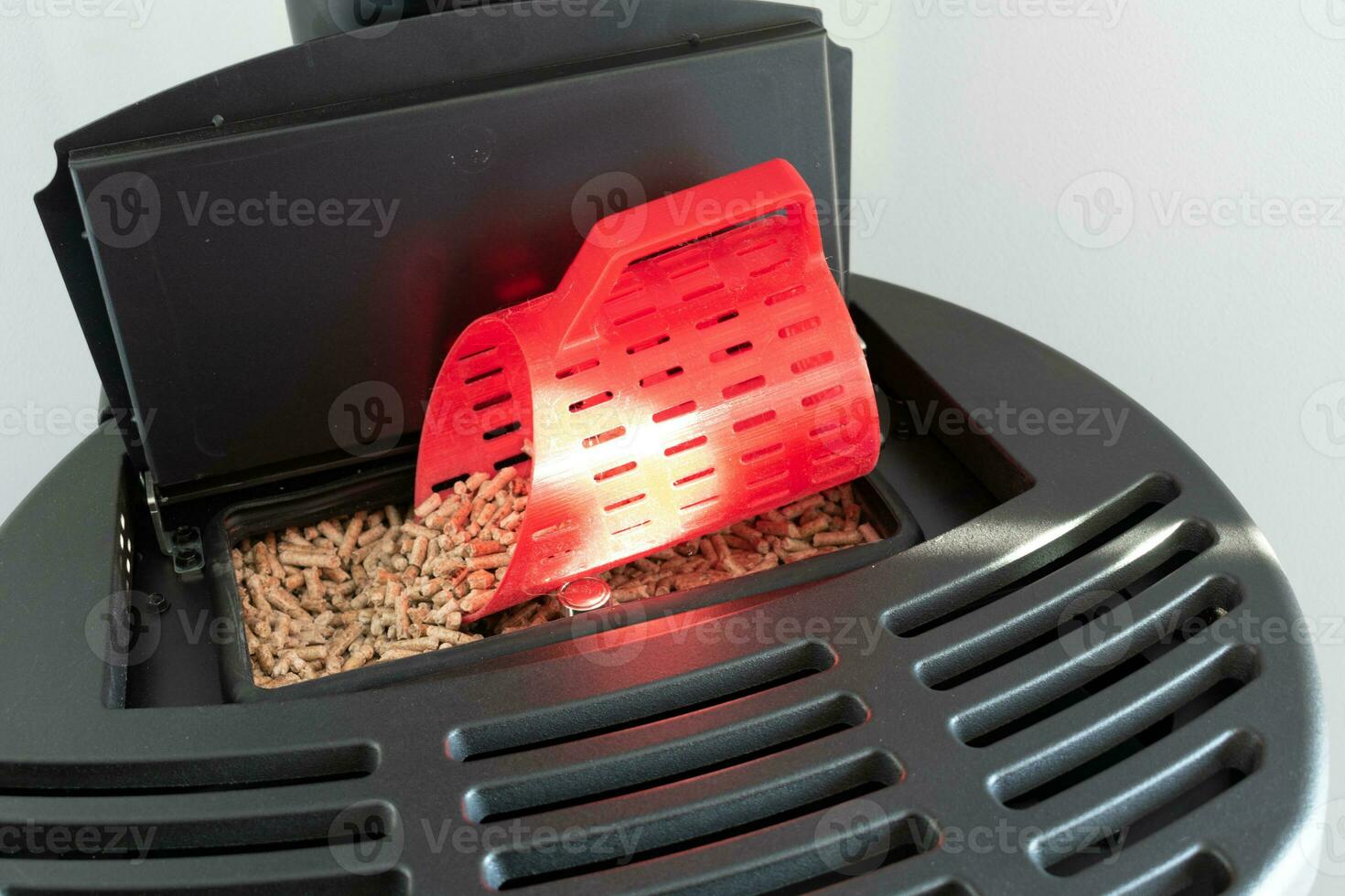 Modern domestic pellet stove, granules stove with 3d printed bucket photo