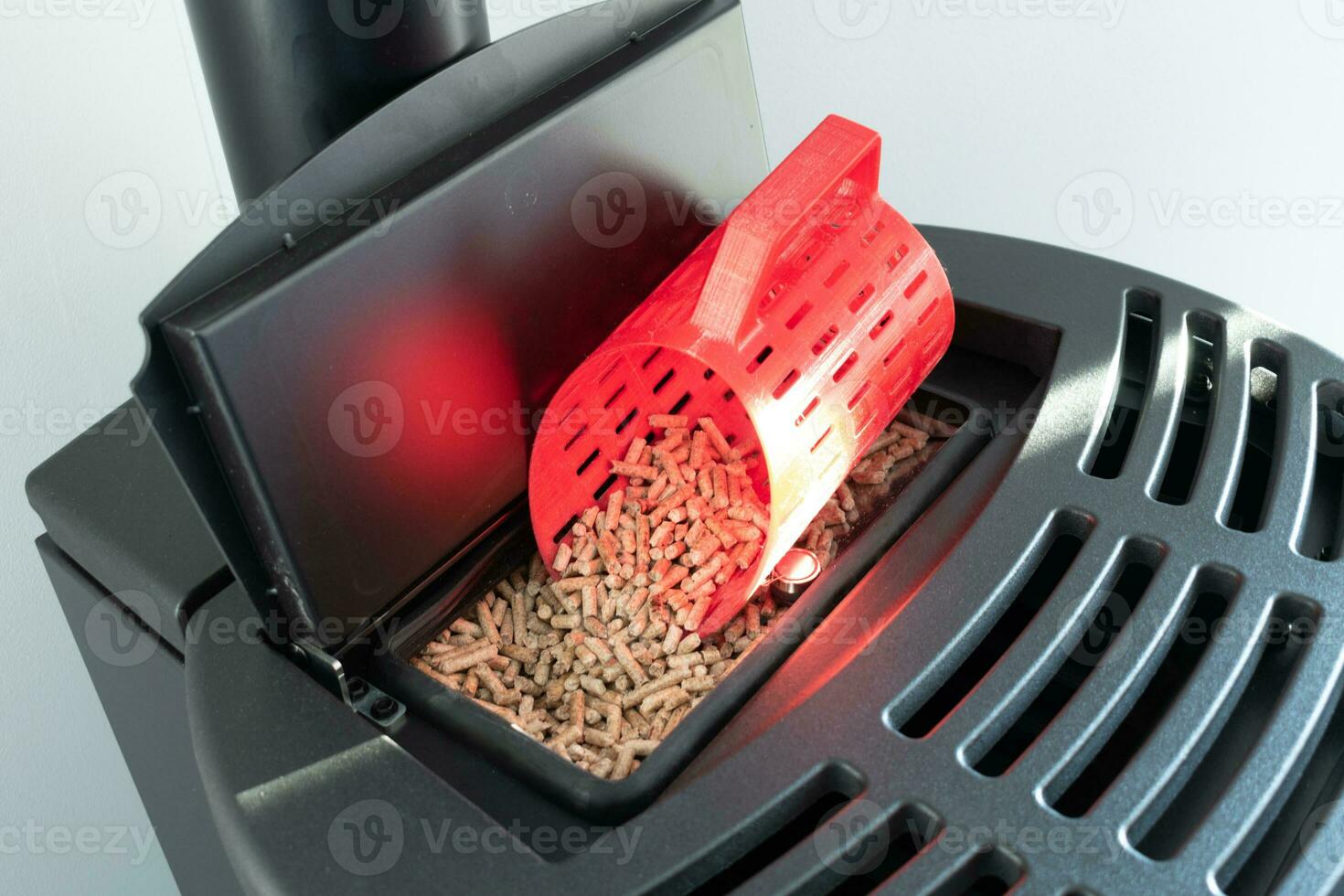 Modern domestic pellet stove, granules stove with 3d printed bucket photo