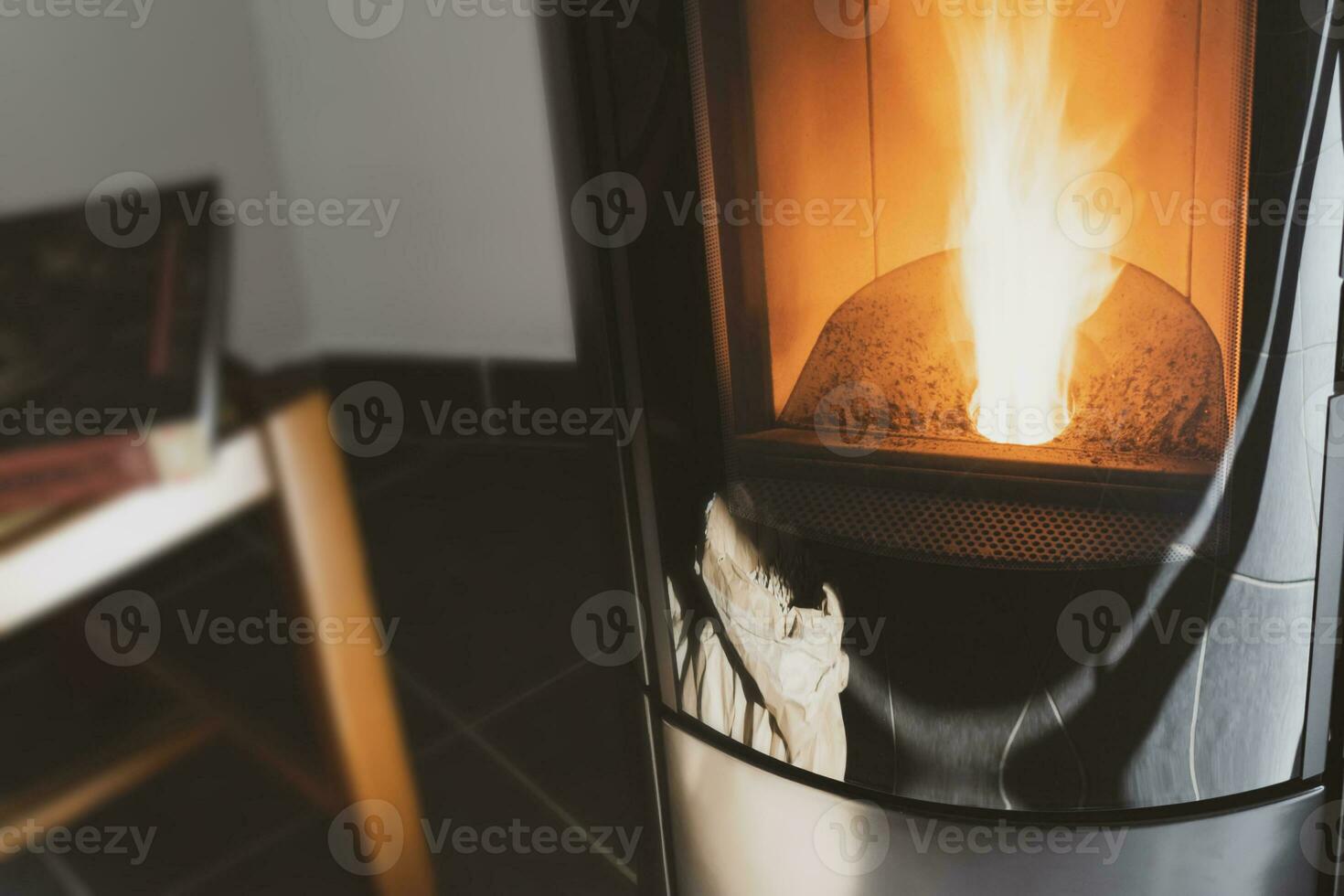 Modern domestic pellet stove, granules stove with flames photo