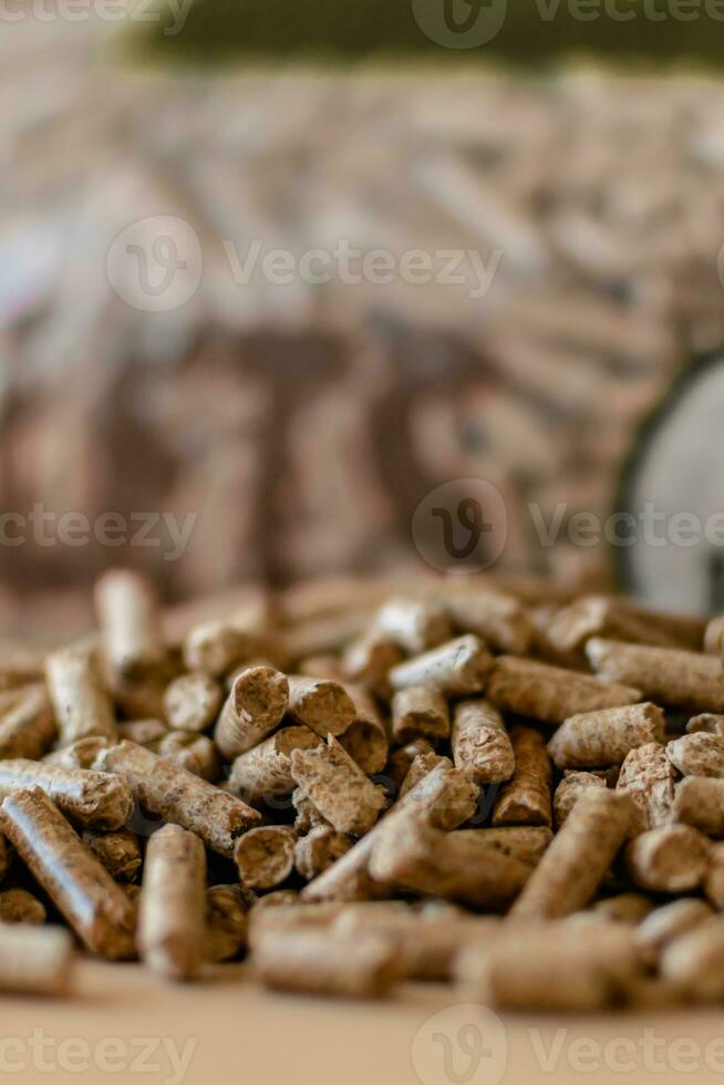 Pile of pellets with bag of granules in the background photo
