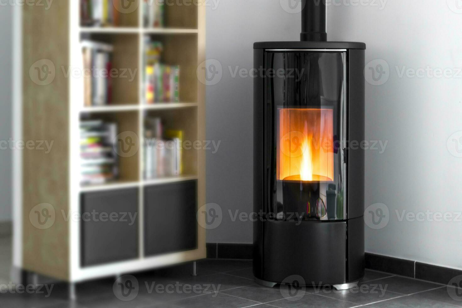 Modern domestic pellet stove, granules stove with flames and library photo