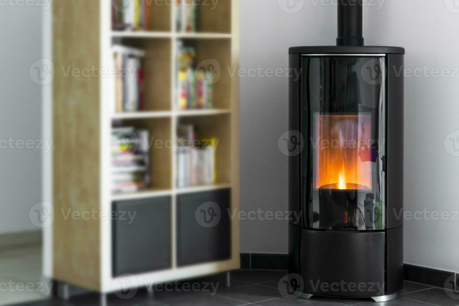 Modern domestic pellet stove, granules stove with flames and library photo