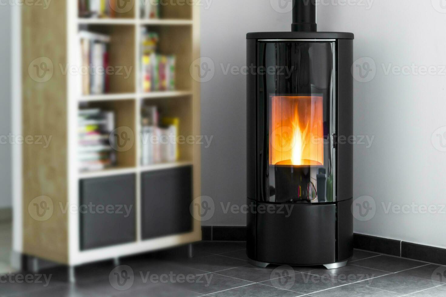 Modern domestic pellet stove, granules stove with flames and library photo