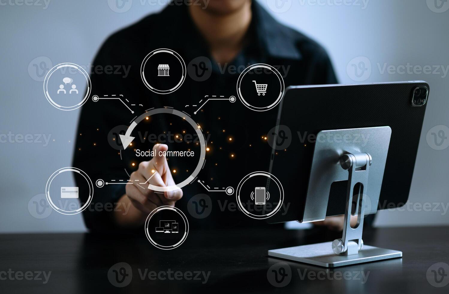 male hand using smart phone and tablet with social commerce icon on virtual screen e-commerce and social media marketing, community in office Social commerce concept photo