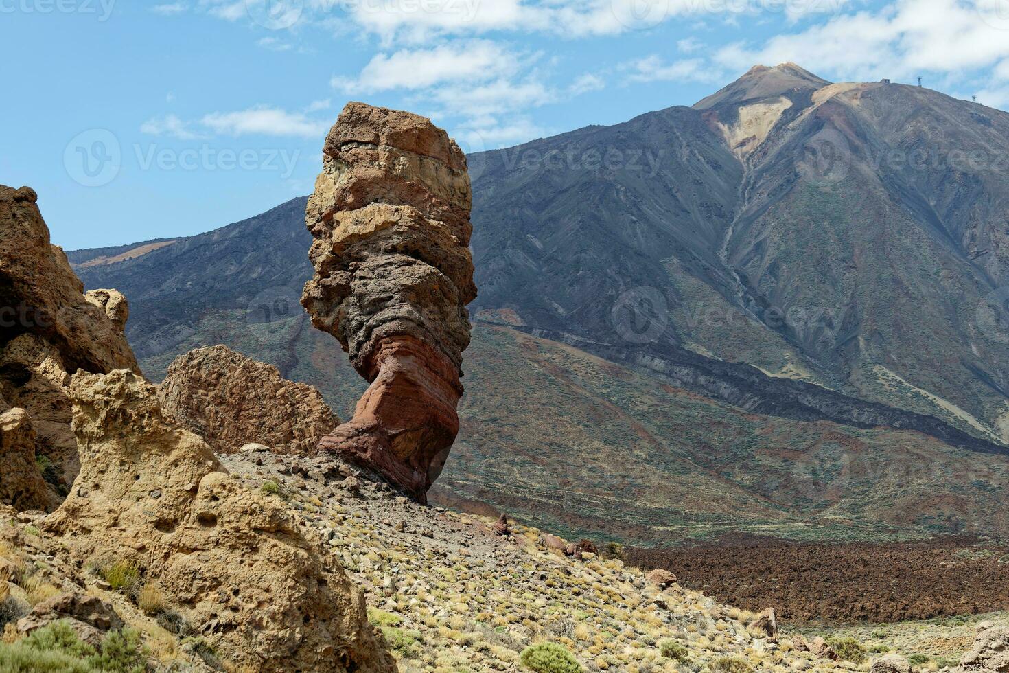 View of Mount Teide, with Roque Cinchado in the foreground. Roque Cinchado is a volcanic rock formation regarded as the symbol of the island of Tenerife, Canary Islands, Spain. Teide National Park. photo