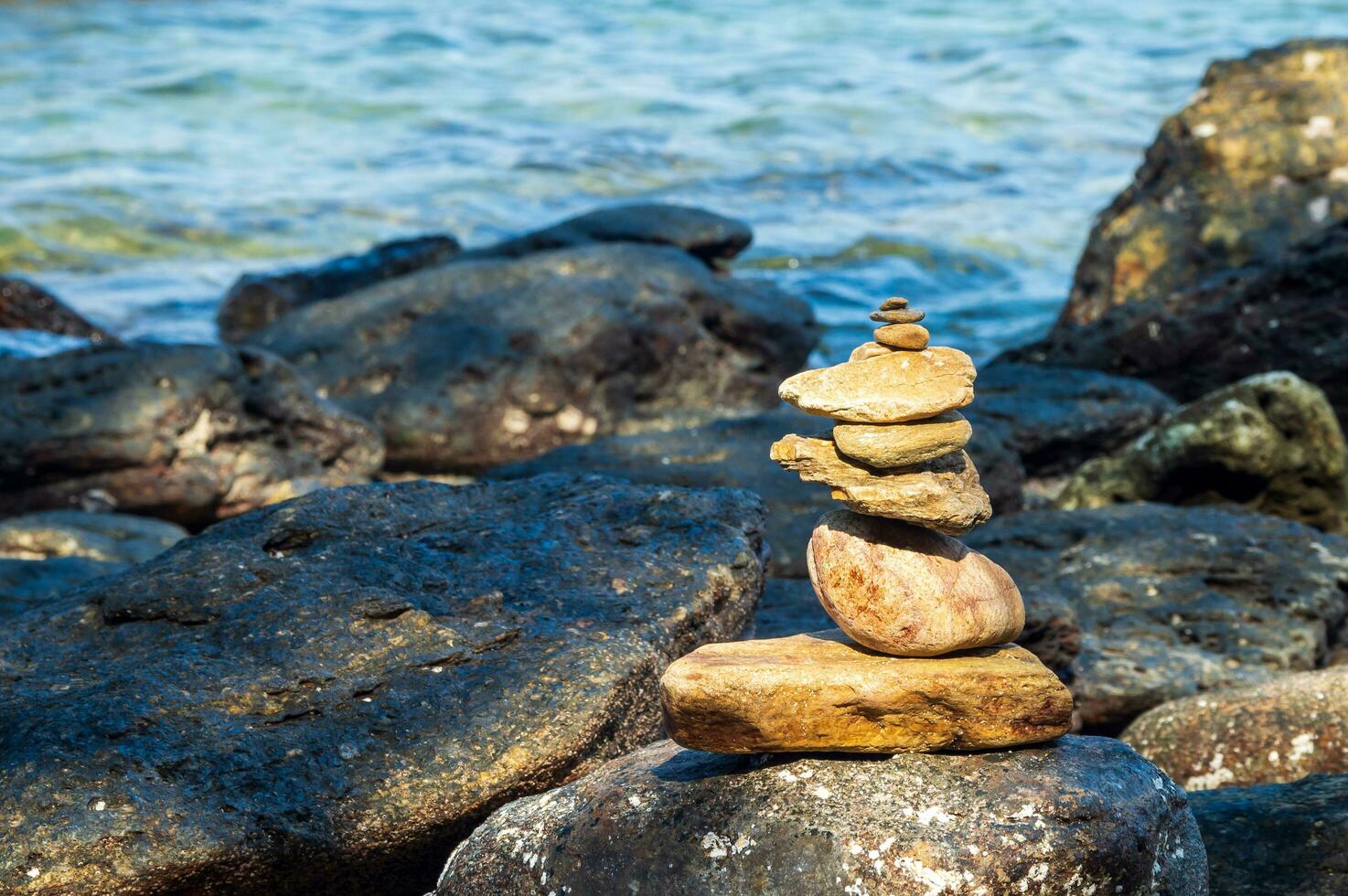 Picture of a rock on the coast of the sea They are stacked beautifully in sequence, still see island And sky clear, look relaxed. Suitable relax and travel Khao Leam Ya National Park Rayong Thailand photo