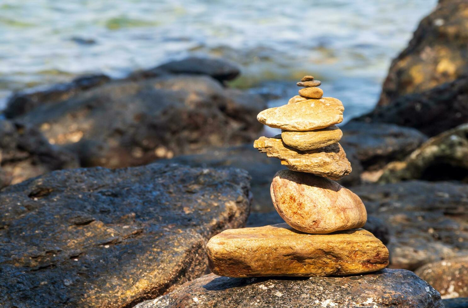 Picture of a rock on the coast of the sea They are stacked beautifully in sequence, still see island And sky clear, look relaxed. Suitable relax and travel Khao Leam Ya National Park Rayong Thailand photo