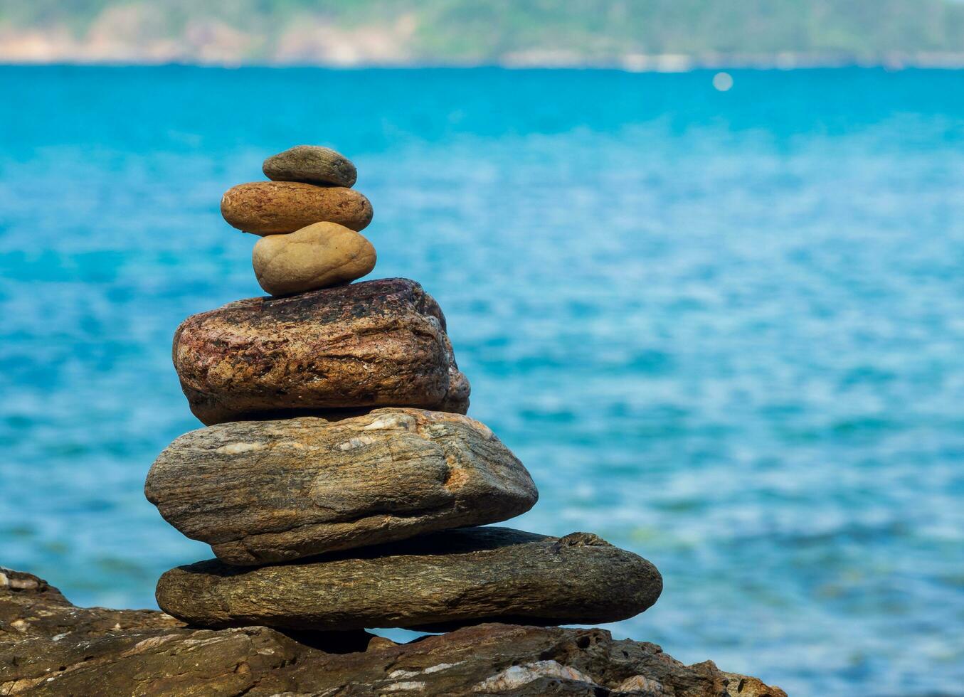 Picture of a rock on the coast of the sea They are stacked beautifully in sequence, still see island And sky clear, look relaxed. Suitable relax and travel Khao Leam Ya National Park Rayong Thailand photo