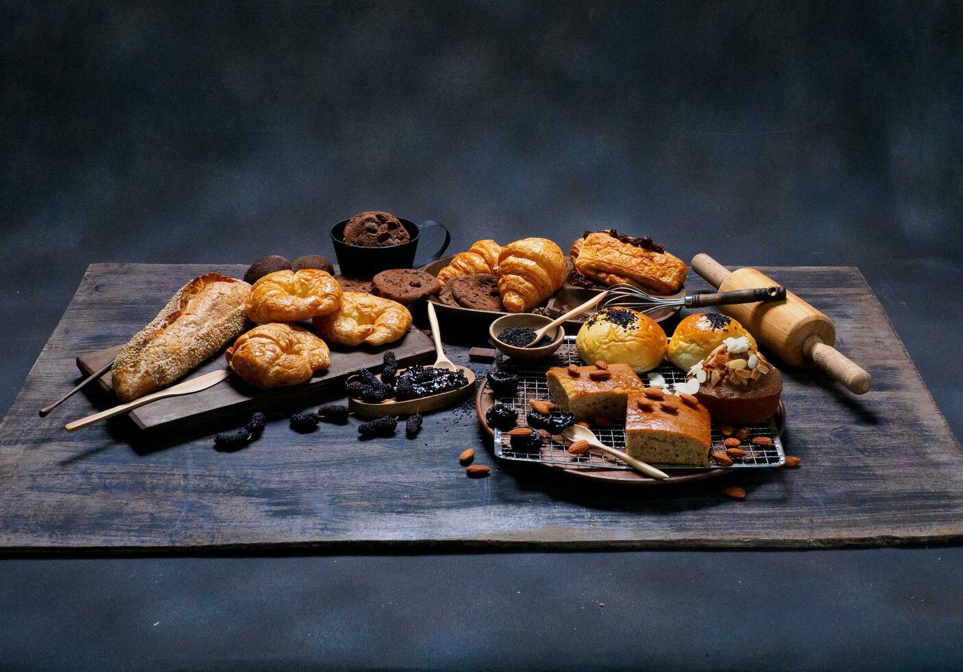 top view fresh bread brown  raisins sesame bakery made from wheat flour food homemade suitable for healthy eating on wooden table floor black rustic dark background photo