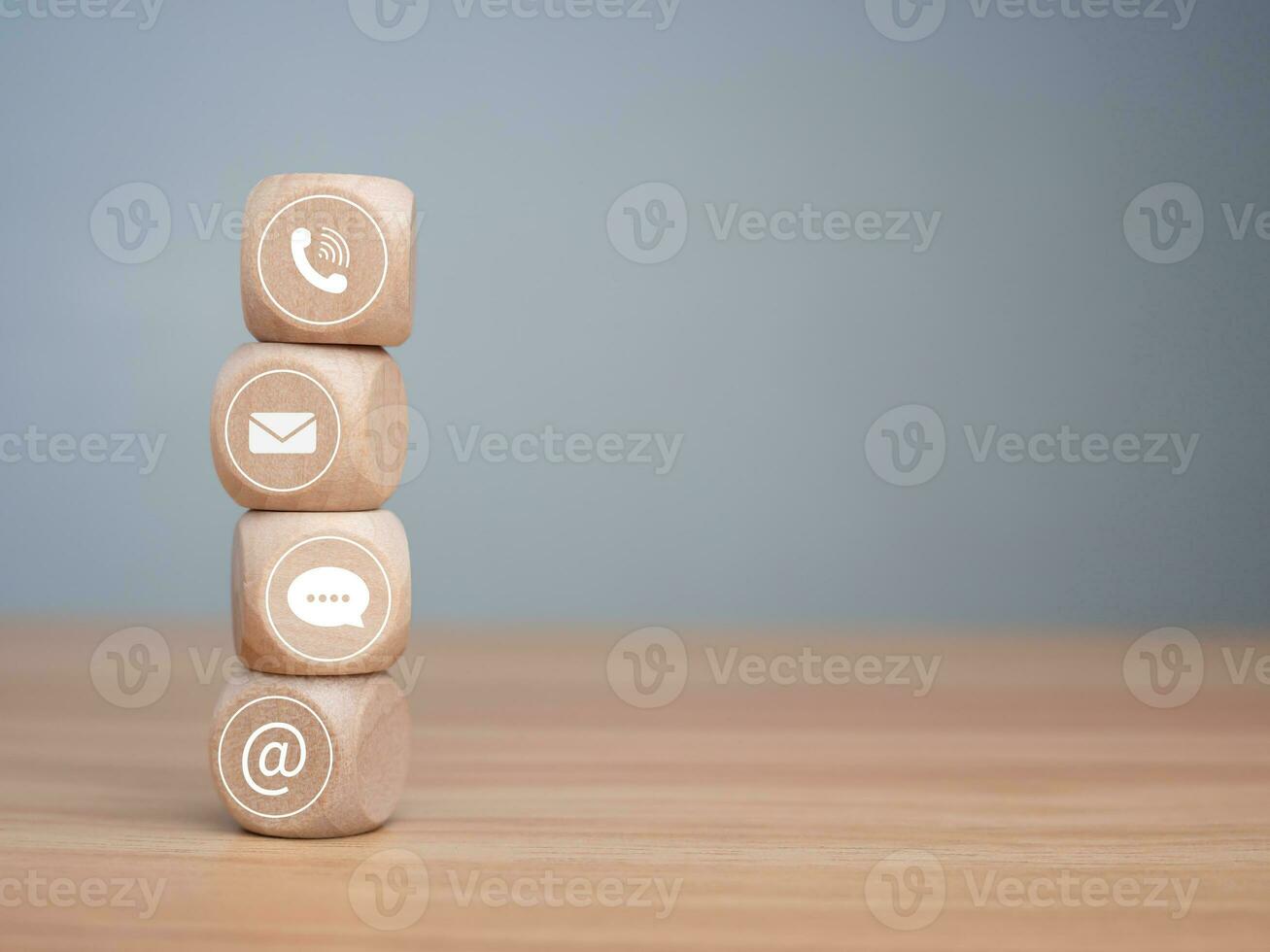 Website page contact us or e-mail marketing concept, Customer support hotline Contact us people connection. phone, email, address and chat message icon on wooden blocks, marketing online concept. photo