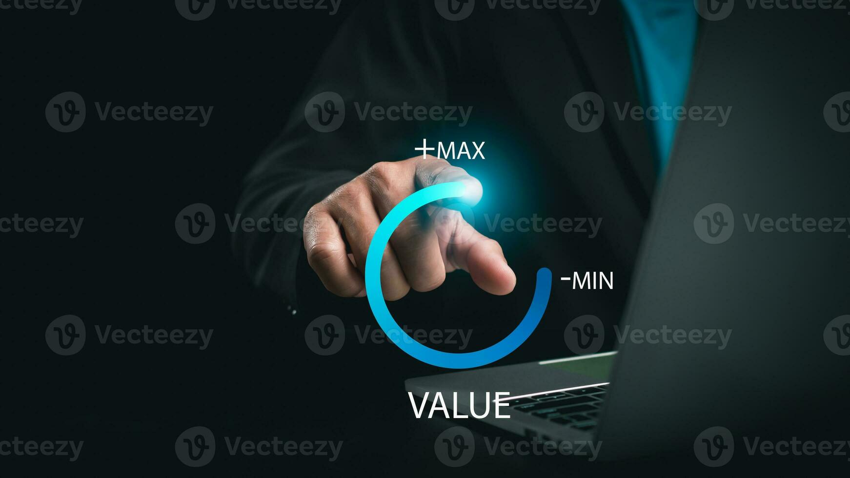 Businessman is pulling up circle progress bar with the word VALUE on dark tone background, value added or business growth concept, increase value, Growth value. photo