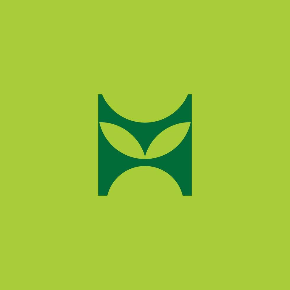 letra metro h hoja verde sencillo geométrico logo vector