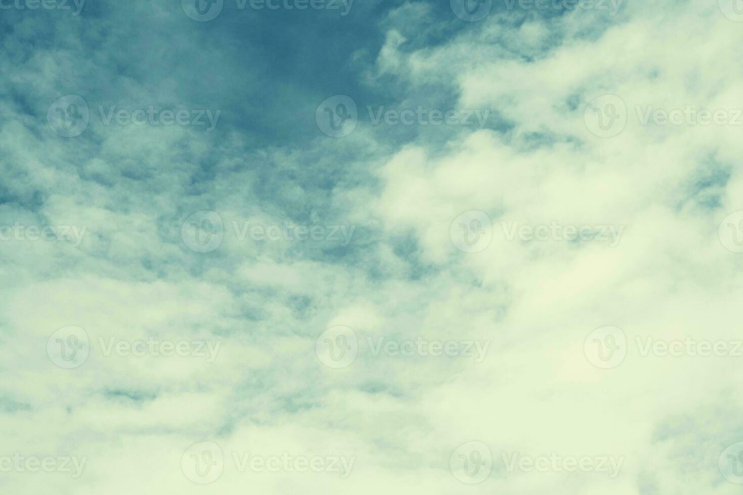 Blurred background. Blue sky and white fluffy clouds. photo