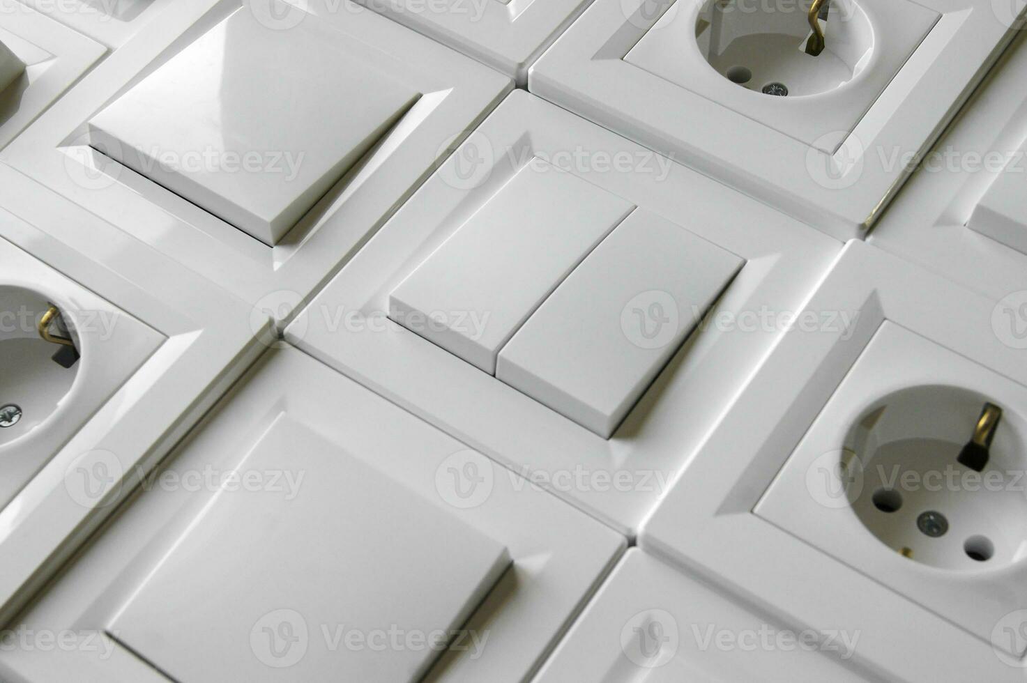 Many European outlets and switches are located next to each other. photo