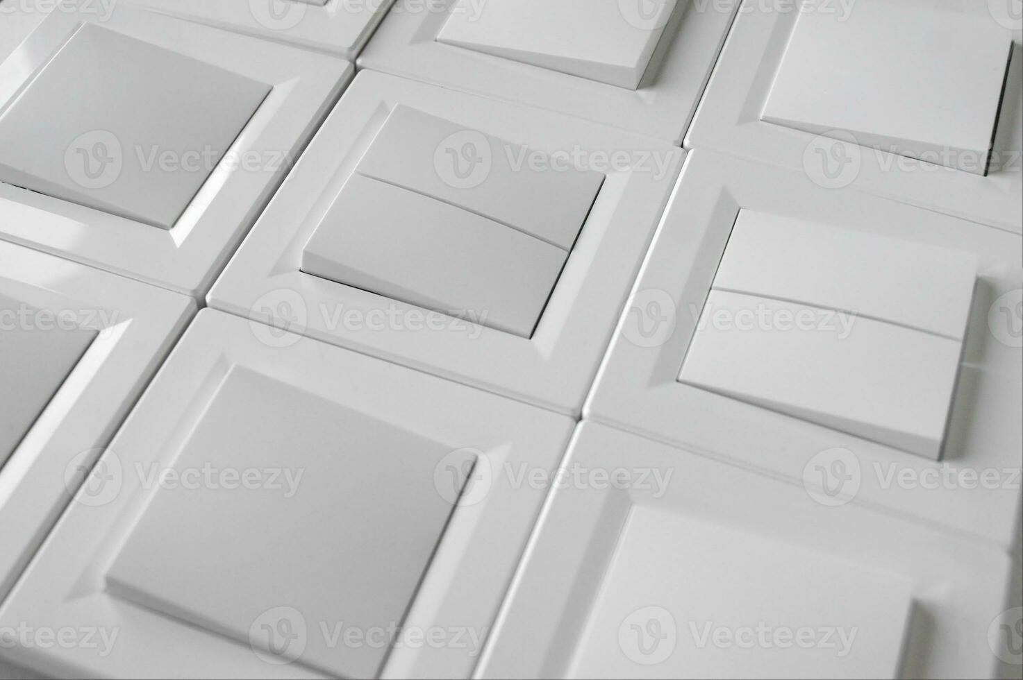 Many light switch, a plastic mechanical switch of white color. photo
