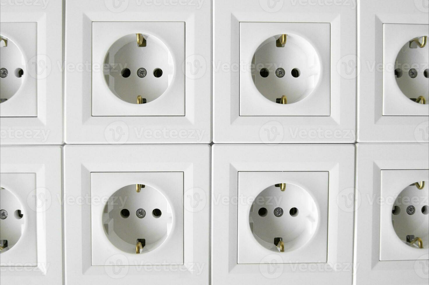 Many of white European high voltage 220W sockets. photo