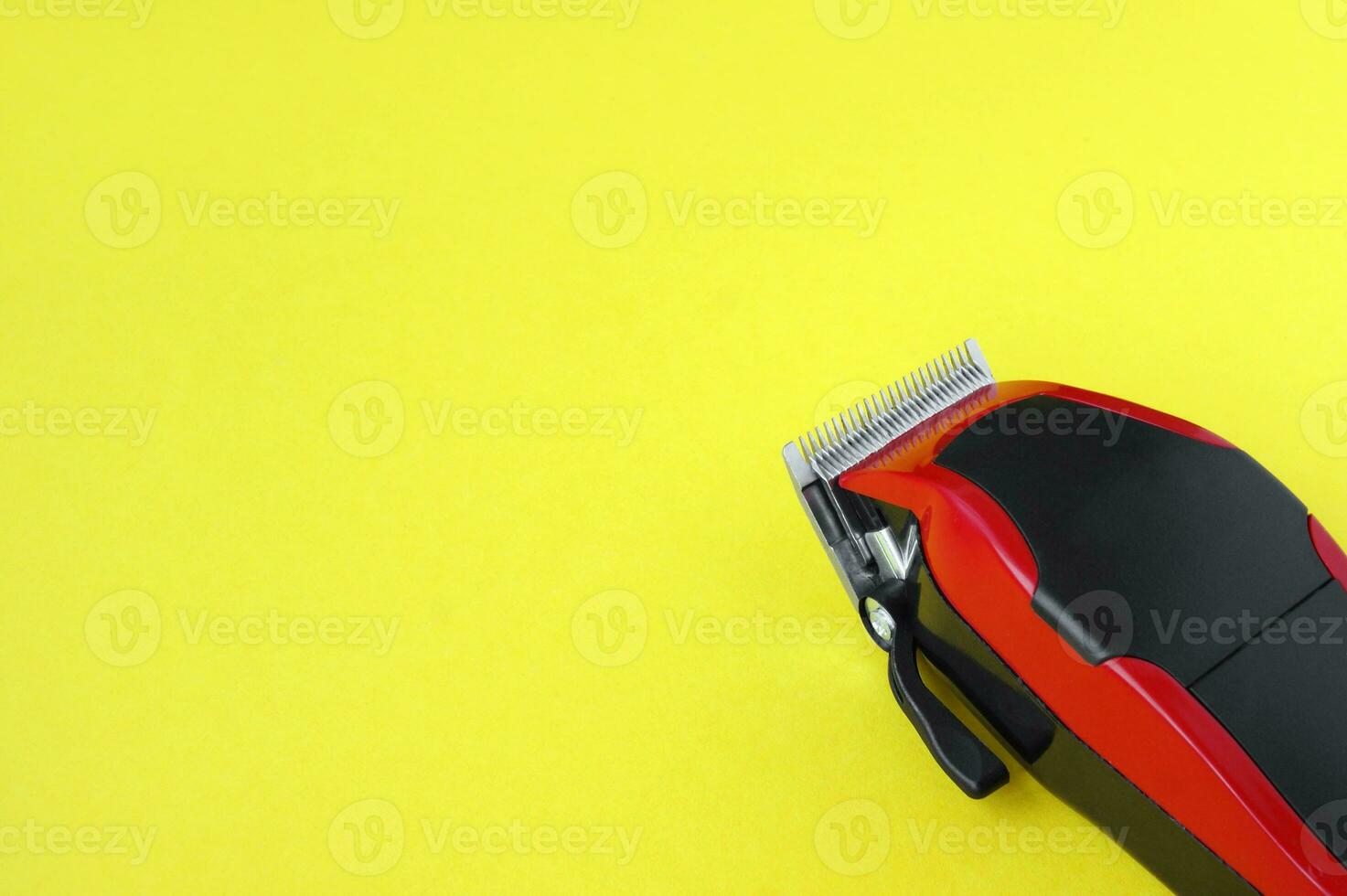 Hair clipper close-up on a yellow background. photo