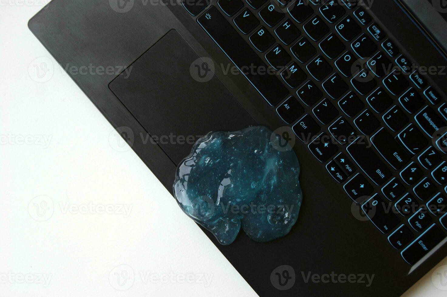 Blue soft gel cleaning dust on keyboard. photo