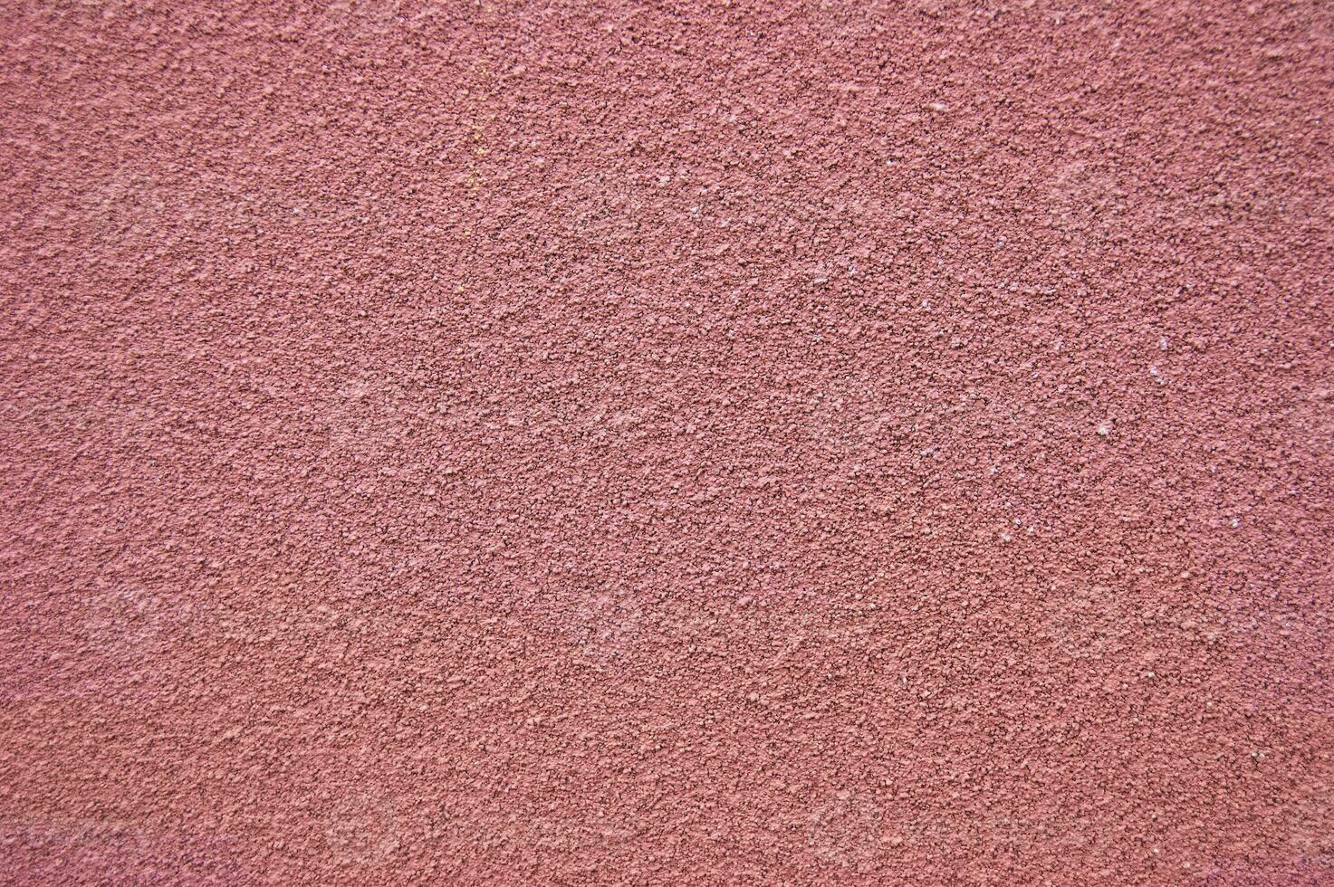 Pink horizontal wall covered with plaster texture. photo