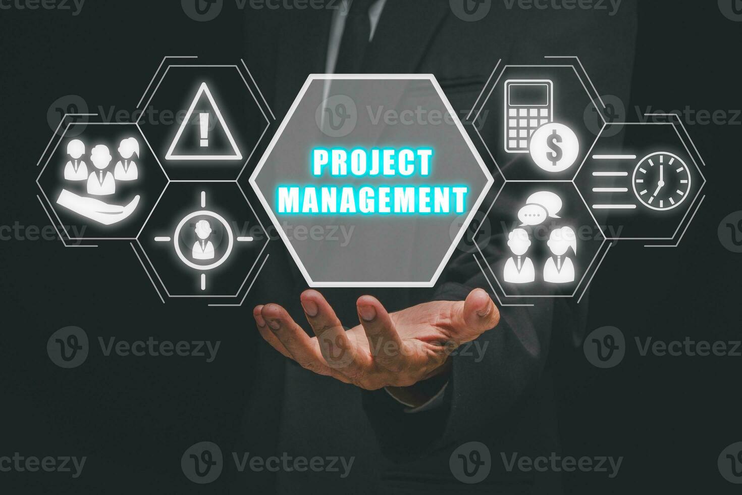 Project management concept, Businessman hand holding project management icon on virtual screen, cost, time, scope, human resources, risks, quality and communication. photo