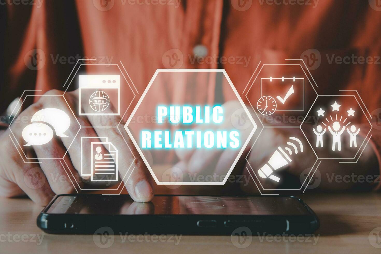 Public Relations concept, Man hand touching mobile phone on office desk with public Relations icon on virtual screen. photo