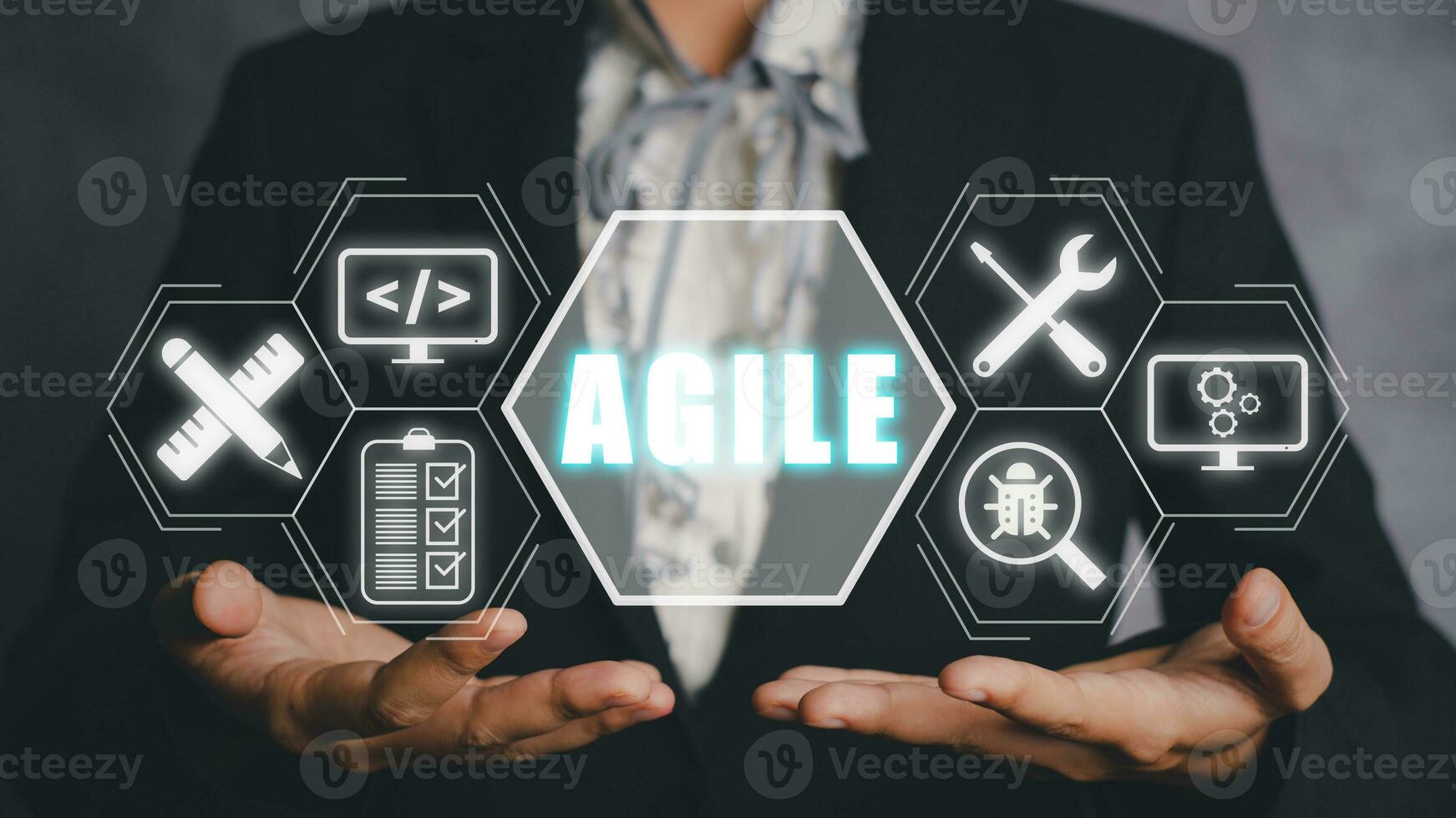 Agile development methodology concept, Business person hand holding VR screen Agile icon on office, Technology concept. photo