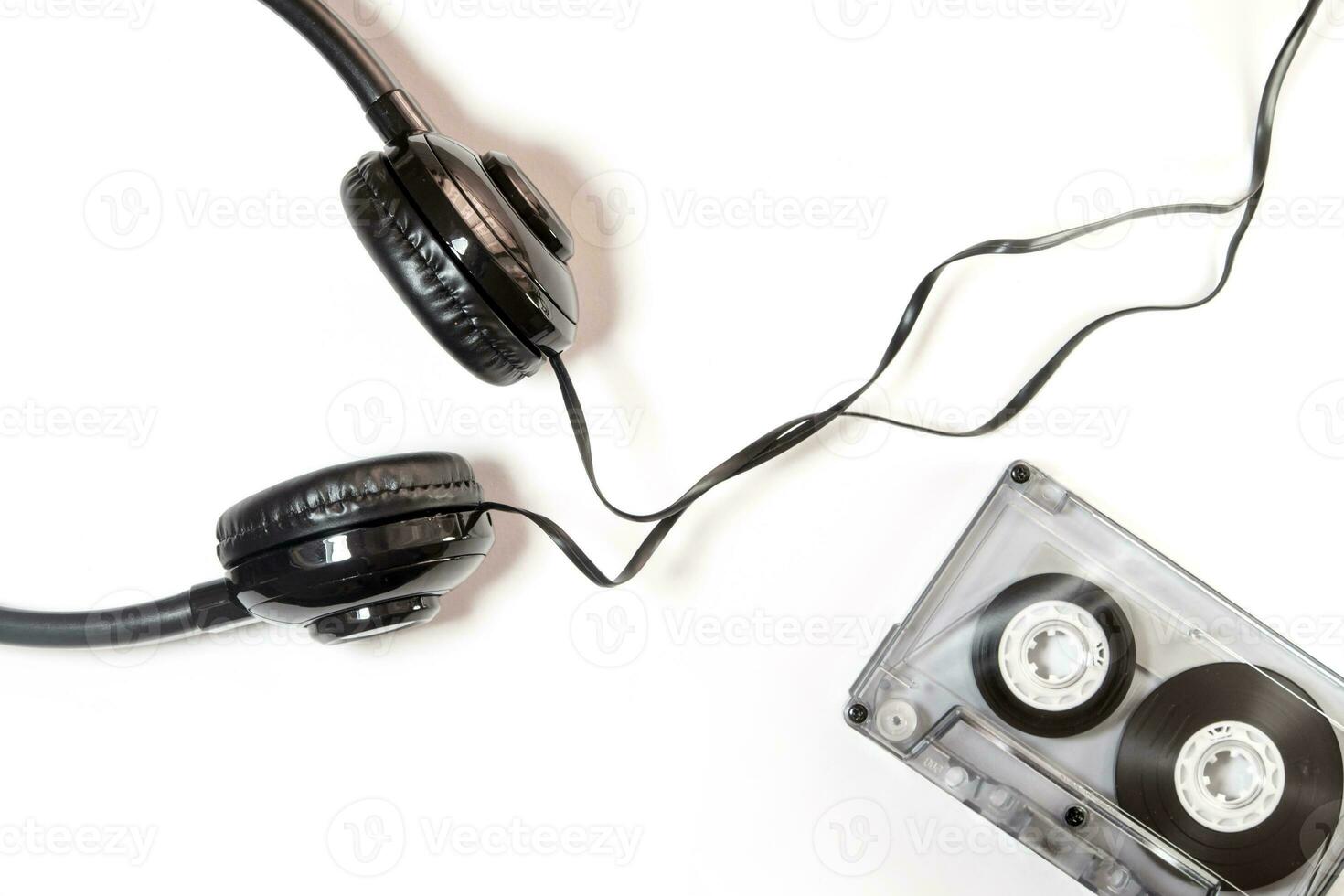 Audio cassette tape and headphone isolated on white background photo