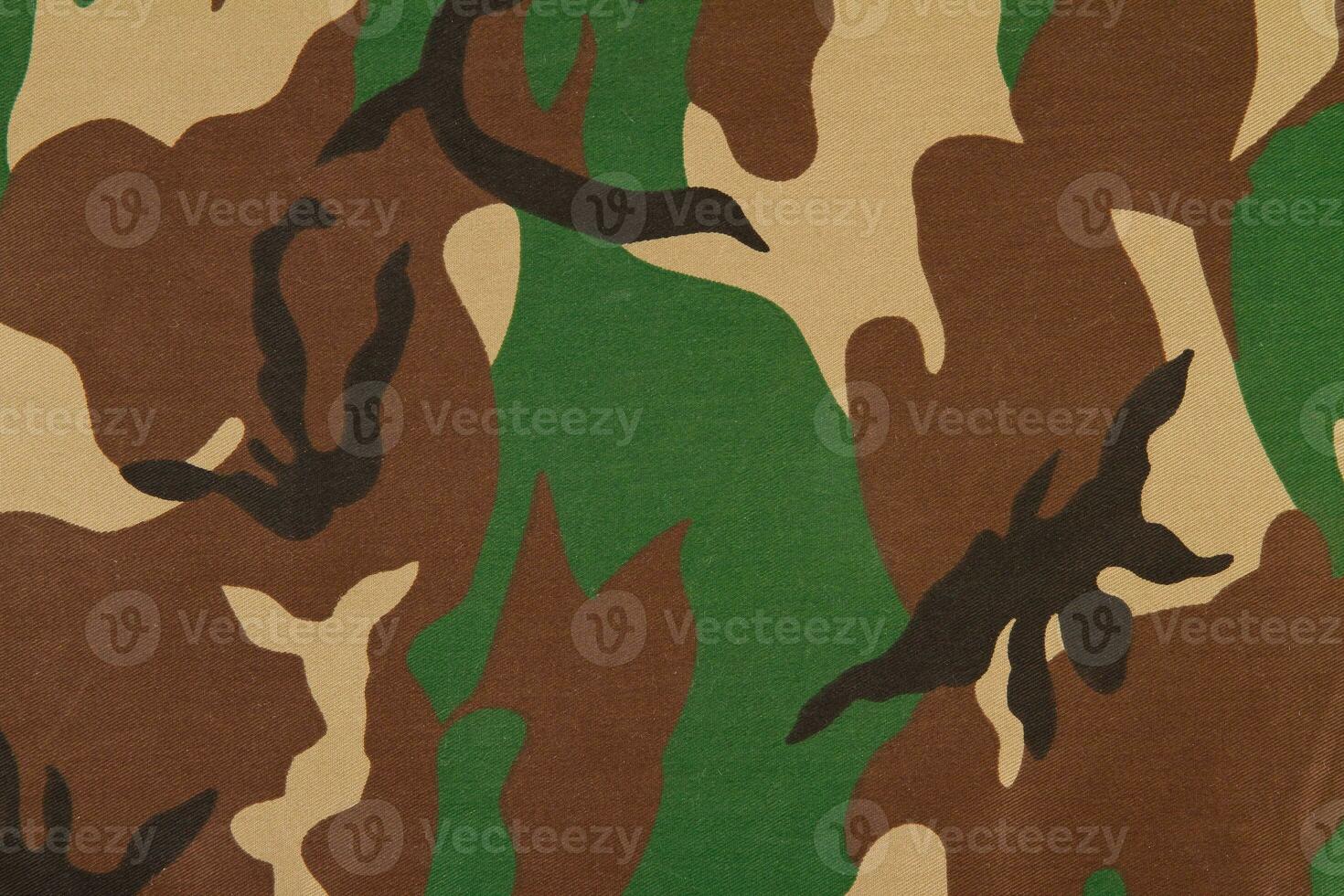 Camouflage pattern on cloth. Woodland style. photo