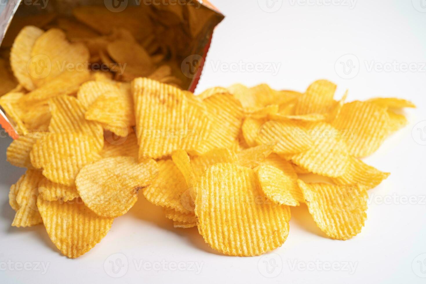 Potato chips, delicious BBQ seasoning spicy for crips, thin slice deep fried snack fast food in open bag. photo