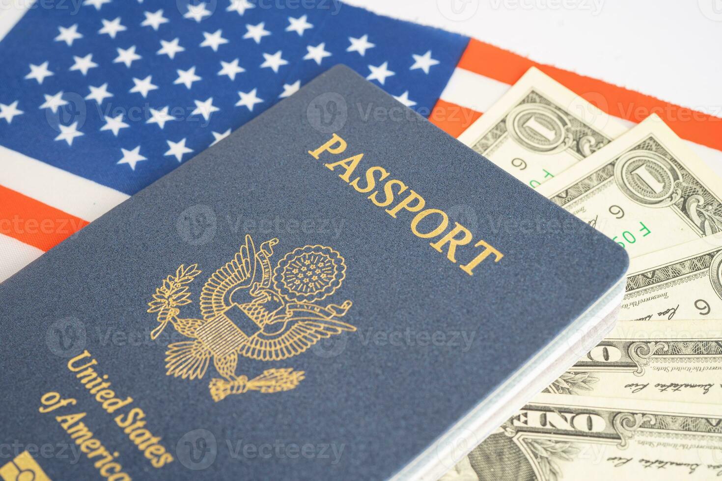 US passport issued to citizen and national of the United States of America to travel in most countries outside with USA flag and dollar money. photo