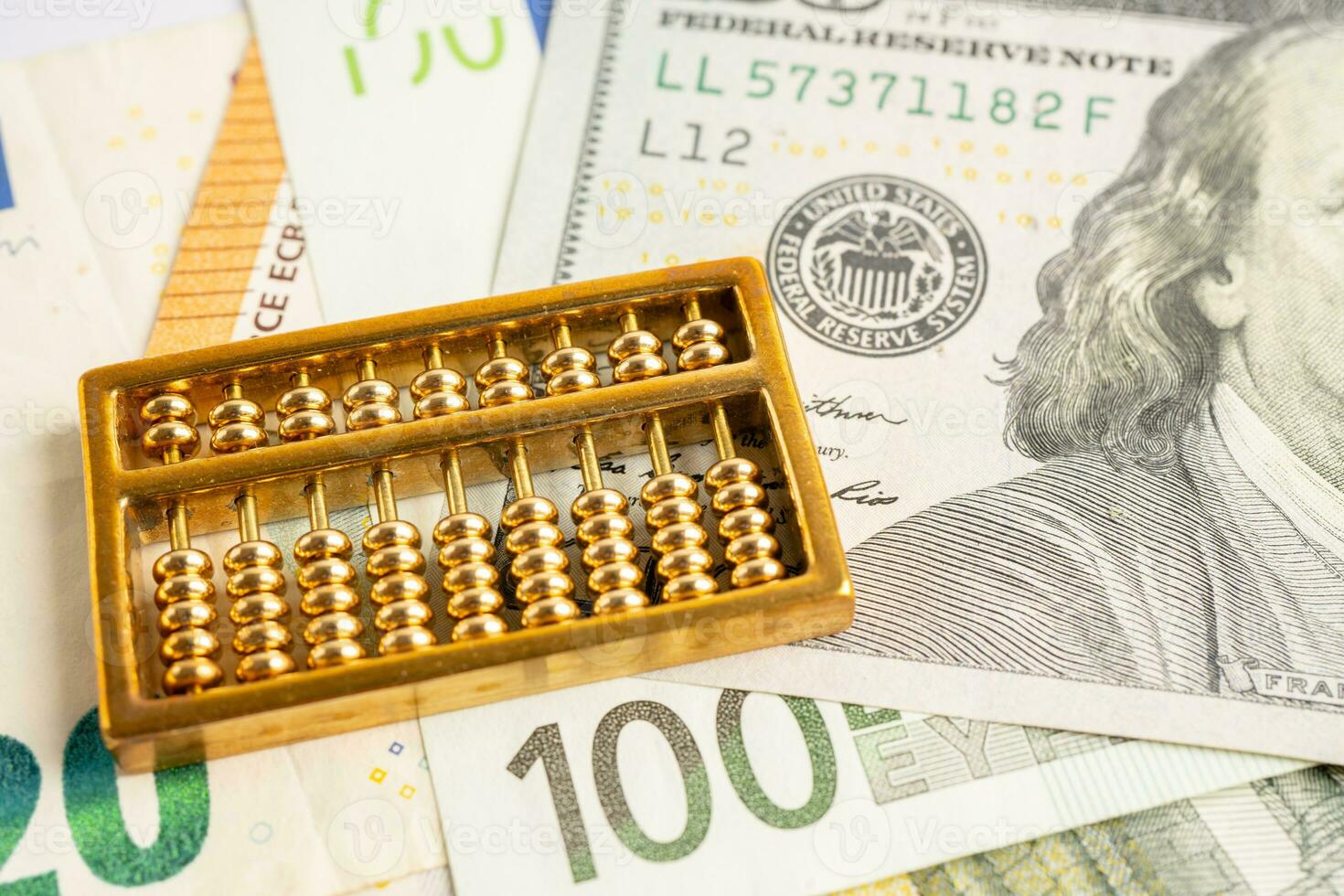 Gold abacus on Euro banknote money, economy finance exchange trade investment concept. photo