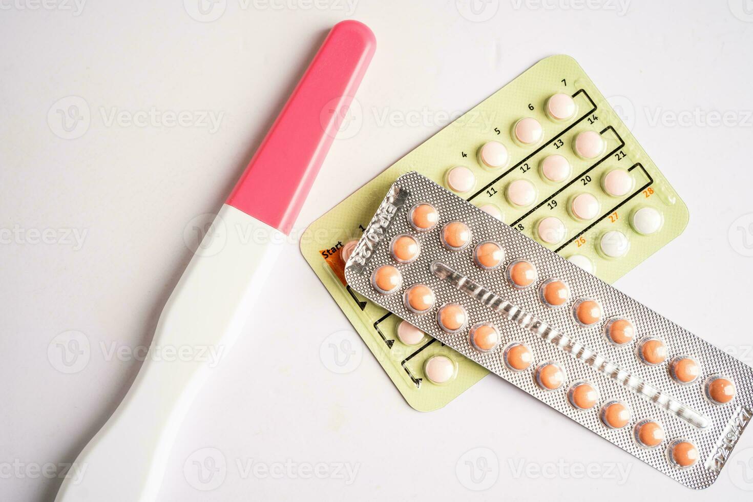 Pregnancy test and birth control pills, contraception health and medicine. photo