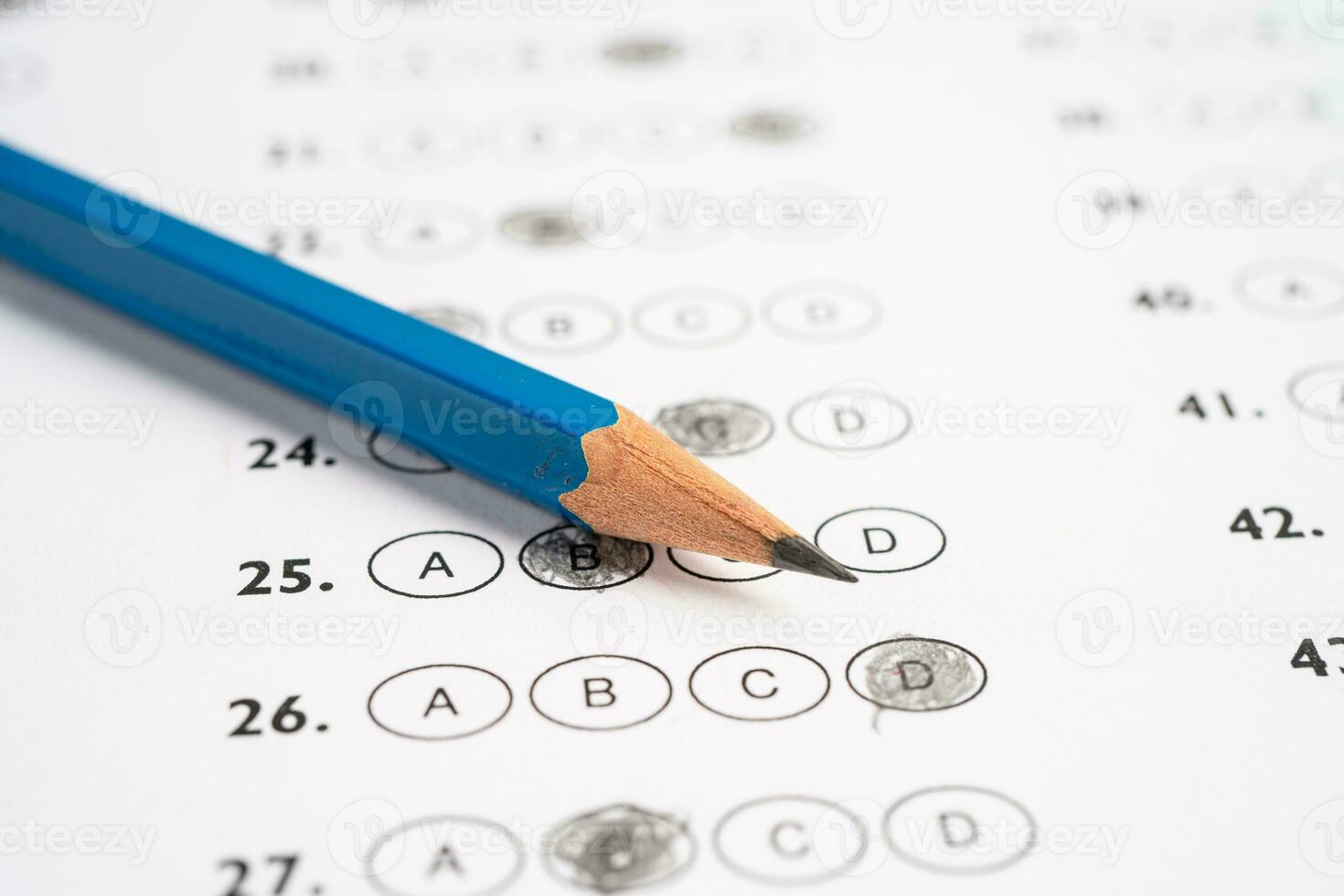 Answer sheets with pencil drawing fill to select choice, education concept. photo