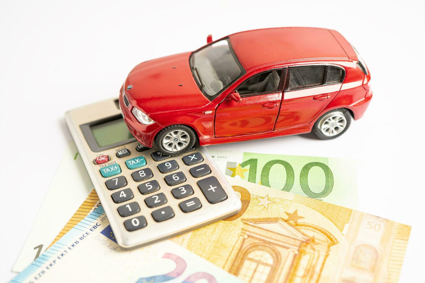 BANGKOK, THAILAND SEPTEMBER 2, 2023, Car model on calculate and EURO banknote, Car loan, Finance, saving money, insurance and leasing time concepts. photo