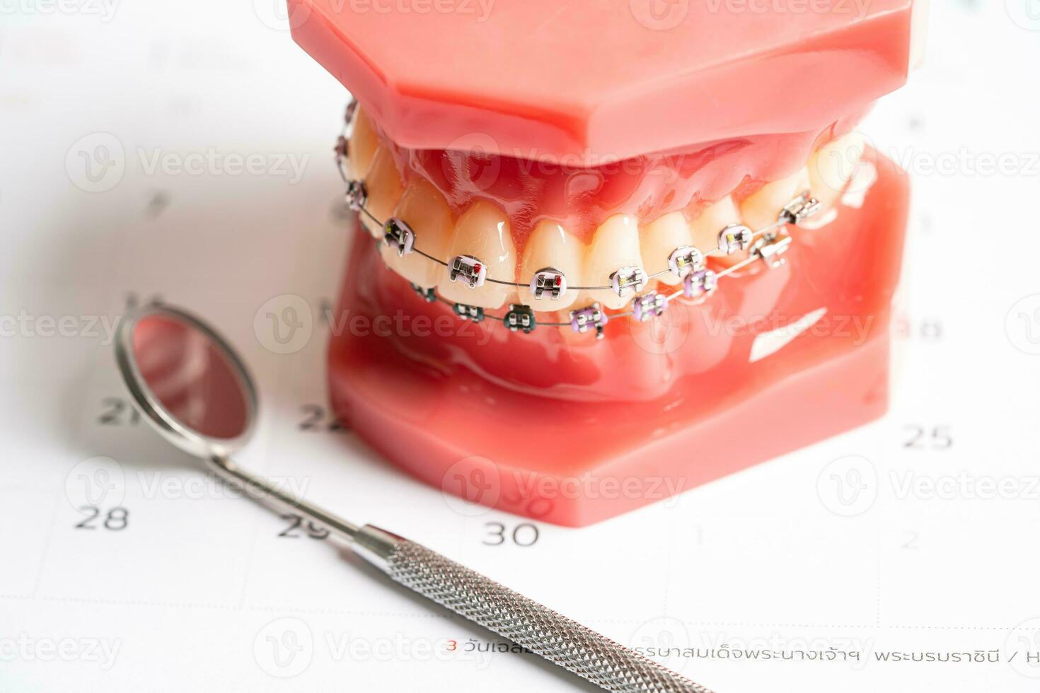 Dental appointment reminder in calendar, healthy teeth, dental health care. photo